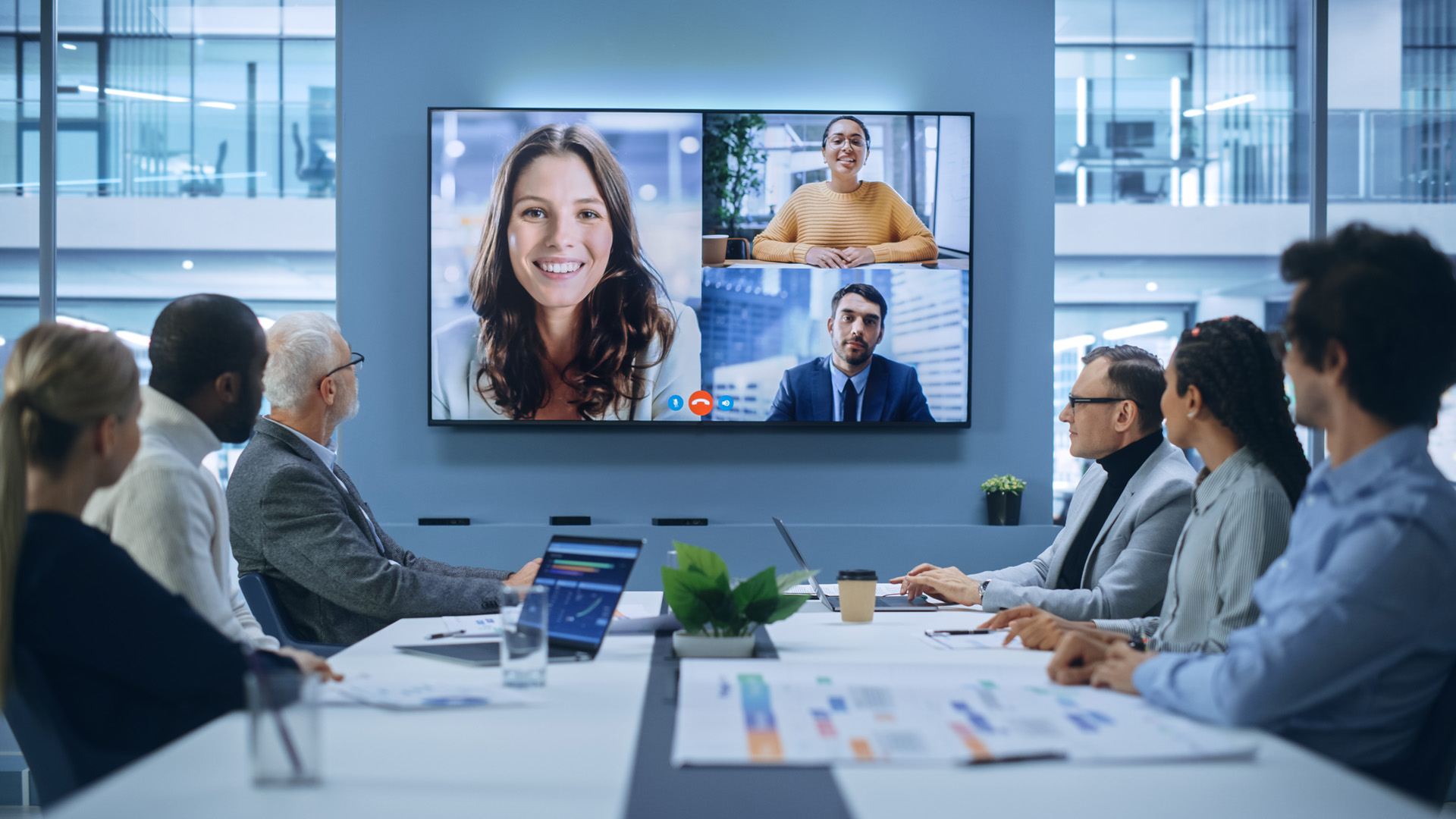 Team engaged in a video conference using cutting-edge collaboration technologies.